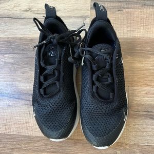 Worn unisex NIKE’s black and white size 11.